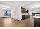 Bright and spacious kitchen featuring dark cabinets, tile backsplash, and an open layout at 1456 S Jasper St, Aurora, CO 80017