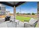 This home has an outdoor seating area including a seating set and a grill at 17276 E 103Rd Ave, Commerce City, CO 80022