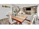 Charming dining room featuring a rustic wood table, comfortable seating, and inviting decor for gatherings at 17276 E 103Rd Ave, Commerce City, CO 80022