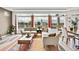 Bright living room with large windows, modern furniture, and stylish decor for relaxation and gatherings at 17276 E 103Rd Ave, Commerce City, CO 80022