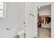 Clean and tidy powder room with a white toilet next to a closet at 17276 E 103Rd Ave, Commerce City, CO 80022