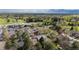 Aerial view of community showcasing the golf course, community center and surrounding lush trees at 7126 Cedarwood Cir, Boulder, CO 80301