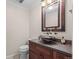 Unique bathroom featuring a decorative bowl sink, wooden cabinet, and a modern vanity at 7126 Cedarwood Cir, Boulder, CO 80301