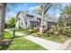 Lovely gray home with a landscaped yard, patio area, and an attached two-car garage at 7126 Cedarwood Cir, Boulder, CO 80301