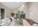 Bright living room featuring a fireplace, hardwood floors, a skylight, and comfortable seating at 7126 Cedarwood Cir, Boulder, CO 80301