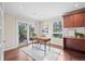 Well-lit office featuring a modern desk, ample storage, and access to a patio area at 7126 Cedarwood Cir, Boulder, CO 80301