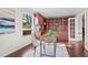 Bright office with built-in wooden shelves, a modern desk, and a view of the outdoors at 7126 Cedarwood Cir, Boulder, CO 80301