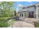 Outdoor patio area featuring brick pavers, a dining set, and easy access to the home's interior at 7126 Cedarwood Cir, Boulder, CO 80301
