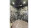 The luxurious shower features dark stone tile, a rain shower head, and built-in lighting at 7126 Cedarwood Cir, Boulder, CO 80301