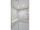 Modern shower area with tiled wall, bench, and glass surround at 7126 Cedarwood Cir, Boulder, CO 80301