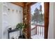 Inviting entryway with rustic log walls and mountain views at 11498 Pauls Ln, Conifer, CO 80433