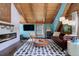 Rustic living room featuring a fireplace, leather sofa, and wood beams at 11498 Pauls Ln, Conifer, CO 80433