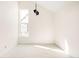 Bright bedroom with neutral carpet, fresh paint, a contemporary light fixture, and ample natural light at 5780 W 92 Ave, Westminster, CO 80031