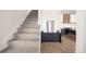 Entryway features a staircase and modern console, leading to the kitchen at 5780 W 92 Ave, Westminster, CO 80031