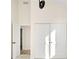 Bright hallway featuring a closet with sliding doors and contemporary light fixture at 5780 W 92 Ave, Westminster, CO 80031