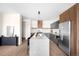 Contemporary kitchen boasting an expansive island, modern cabinetry, and stylish lighting at 5780 W 92 Ave, Westminster, CO 80031