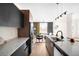 Open-concept kitchen with stainless steel appliances and a view into the living room at 5780 W 92 Ave, Westminster, CO 80031