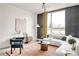 Cozy living room with modern furnishings, artistic decor, and an abundance of natural light at 5780 W 92 Ave, Westminster, CO 80031