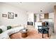 Inviting living room connected to a modern kitchen, creating an open and airy living space at 5780 W 92 Ave, Westminster, CO 80031