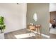 Bright office featuring a live plant, wood desk, stylish chair, and glimpses of a bedroom at 5780 W 92 Ave, Westminster, CO 80031