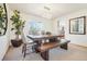 Elegant dining room with a modern chandelier and a stylish, rustic dining set at 8743 Fairview Oaks Ln, Lone Tree, CO 80124