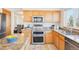 Kitchen featuring stainless steel appliances, granite countertops, and ample cabinet space at 8743 Fairview Oaks Ln, Lone Tree, CO 80124