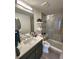 Modern bathroom featuring a glass-enclosed shower and sleek vanity at 2010 S Holly St # 3, Denver, CO 80222