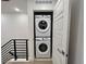 Convenient, stacked laundry units inside a hallway closet at 2010 S Holly St # 3, Denver, CO 80222