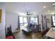 Spacious living room with large windows and comfortable seating at 2010 S Holly St # 3, Denver, CO 80222
