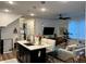 Open-concept living space with kitchen island and modern furnishings at 2010 S Holly St # 3, Denver, CO 80222