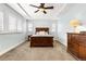 Bright bedroom with carpeted floor, ceiling fan, and large windows at 1128 Starglow Pl, Highlands Ranch, CO 80126