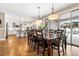 Bright dining room with hardwood floors and access to backyard at 1128 Starglow Pl, Highlands Ranch, CO 80126