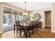 Elegant dining room featuring hardwood floors and sliding glass doors at 1128 Starglow Pl, Highlands Ranch, CO 80126