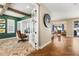 Home office with herringbone floors, built-ins, and a view to the living area at 1128 Starglow Pl, Highlands Ranch, CO 80126