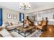 Comfortable living room showcasing hardwood floors and an open floor plan at 1128 Starglow Pl, Highlands Ranch, CO 80126