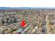 Aerial view of a ranch house with a yard, located in a residential neighborhood at 2681 S Newport St, Denver, CO 80224