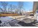 Backyard view showcasing patio, fence, and lawn at 2681 S Newport St, Denver, CO 80224