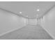 Spacious finished basement with neutral carpeting and recessed lighting at 2681 S Newport St, Denver, CO 80224