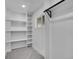 Bright walk-in closet with ample shelving and hanging space at 2681 S Newport St, Denver, CO 80224