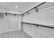 Large walk-in closet with custom shelving and hanging rods at 2681 S Newport St, Denver, CO 80224