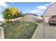 House exterior with attached garage and driveway at 360 Linda Ln, Denver, CO 80221