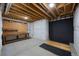 Unfinished basement area with workspace bench and open ceilings at 4821 Bluegate Dr, Highlands Ranch, CO 80130