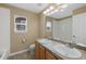 Bathroom with double sinks, a large mirror, and tile flooring at 4821 Bluegate Dr, Highlands Ranch, CO 80130