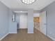 Open bedroom showcasing adjacent hallway, closet and natural light at 4821 Bluegate Dr, Highlands Ranch, CO 80130
