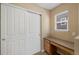 Bedroom featuring a built-in desk, a window, and closet space at 4821 Bluegate Dr, Highlands Ranch, CO 80130