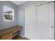 Bedroom featuring a built-in desk, a window, and closet space at 4821 Bluegate Dr, Highlands Ranch, CO 80130