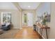 Inviting foyer with hardwood floors and a console table with stylish decor at 4821 Bluegate Dr, Highlands Ranch, CO 80130