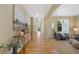 Spacious hallway with hardwood floors, leading to the staircase and multiple rooms at 4821 Bluegate Dr, Highlands Ranch, CO 80130