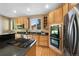 Gourmet kitchen featuring stainless steel appliances, granite countertops, a gas cooktop, and double ovens at 4821 Bluegate Dr, Highlands Ranch, CO 80130
