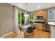 Sunny kitchen with stainless steel appliances, granite countertops, and a breakfast nook overlooking the backyard at 4821 Bluegate Dr, Highlands Ranch, CO 80130